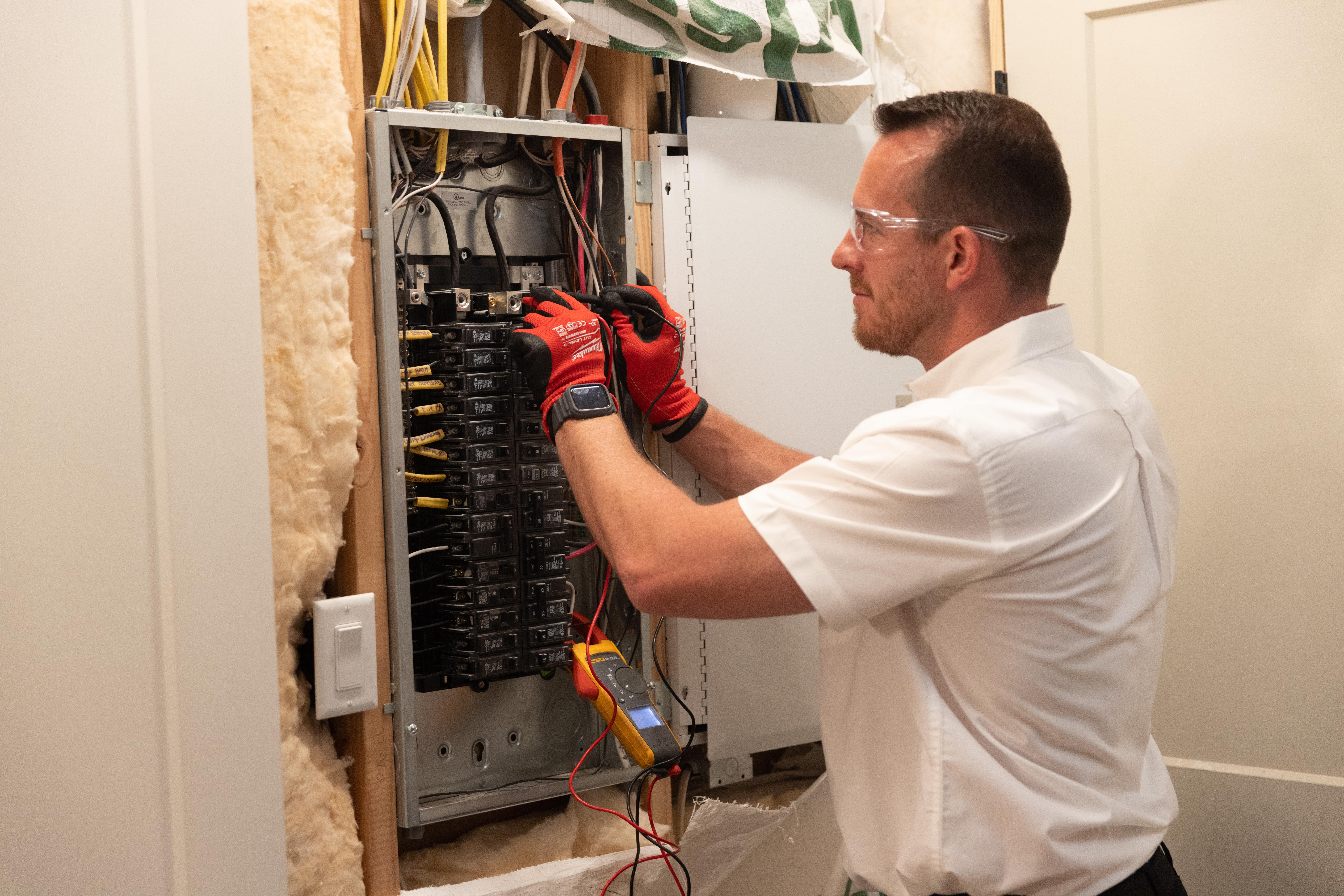 Seattle Electrician working on electrical panel